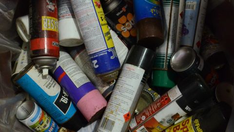 Old aerosol paint cans.
