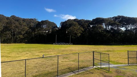 a sports field that is fenced off 