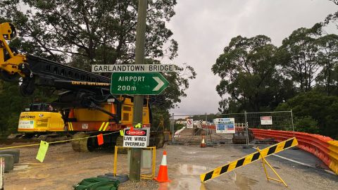 A worksite with signs pointing to Garlandtown and Moruya Airport.