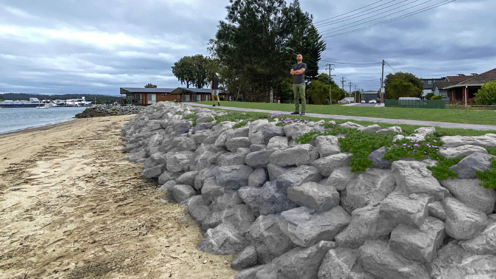 A sloped rock wall has been photoshopped into an image of the coastline