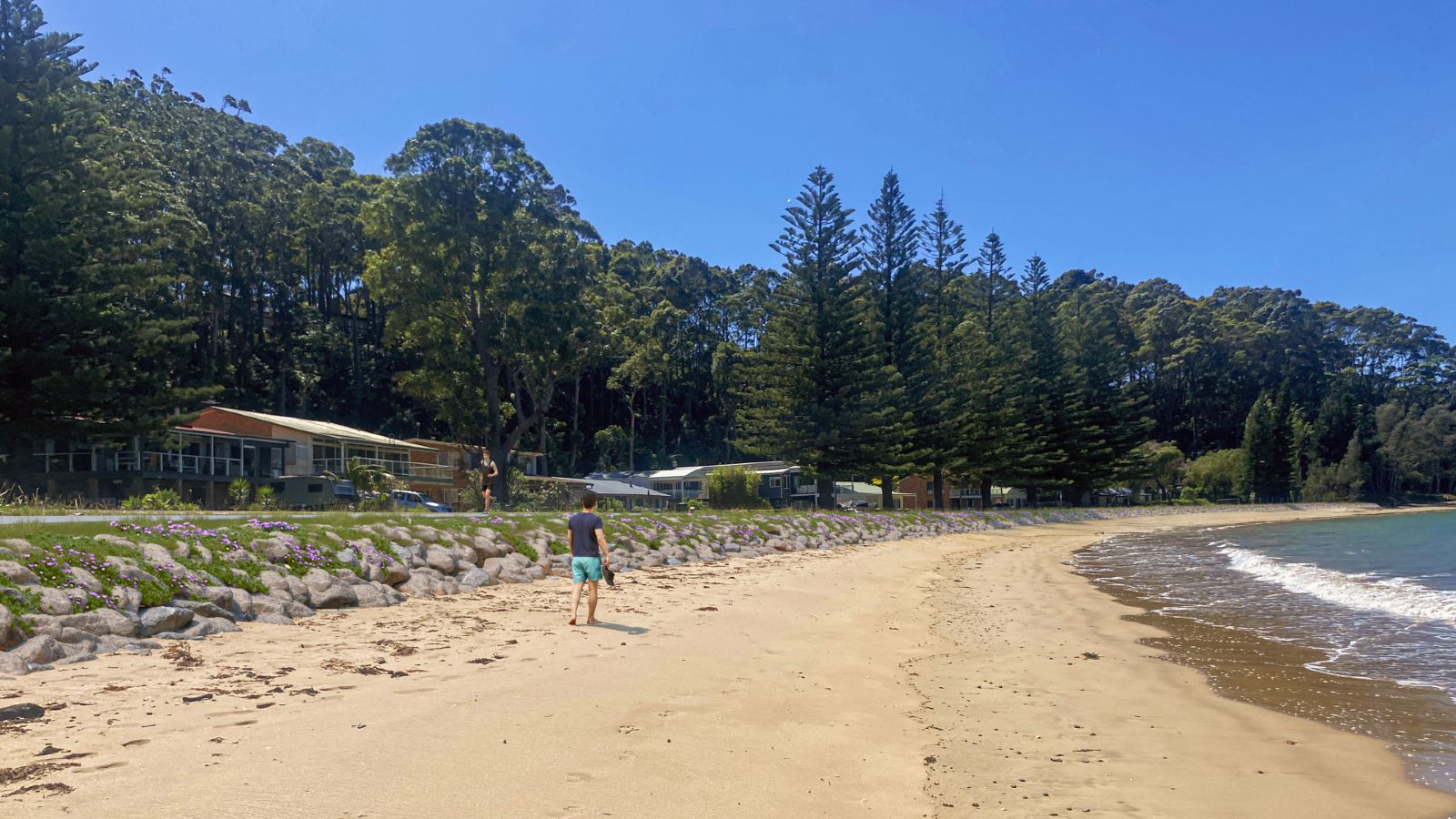 A sloped rock wall has been photoshopped into an image of the coastline.