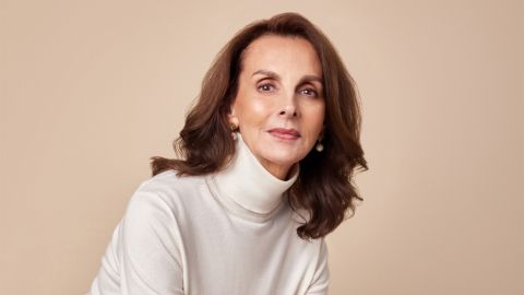 Head and shoulders image of a smiling brown-haired woman.