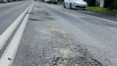 A damaged road surface.