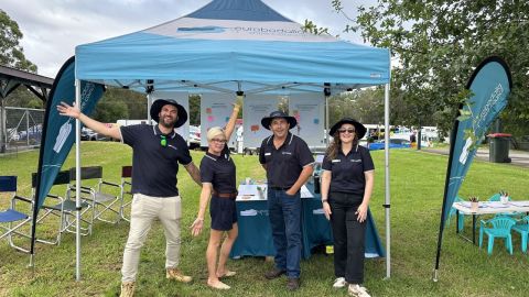 Four council staff posing at pop up stall